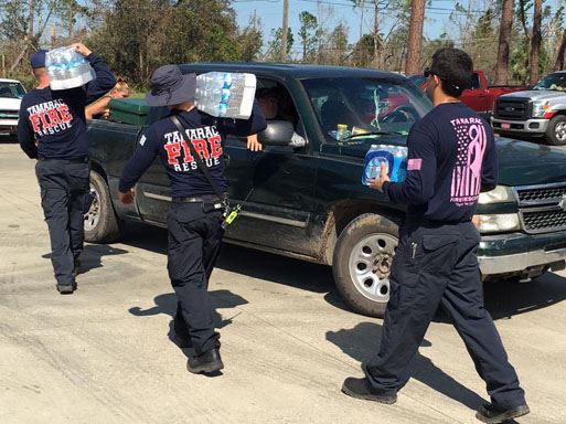 Tamarac Fire Rescue placing bottled water in truck