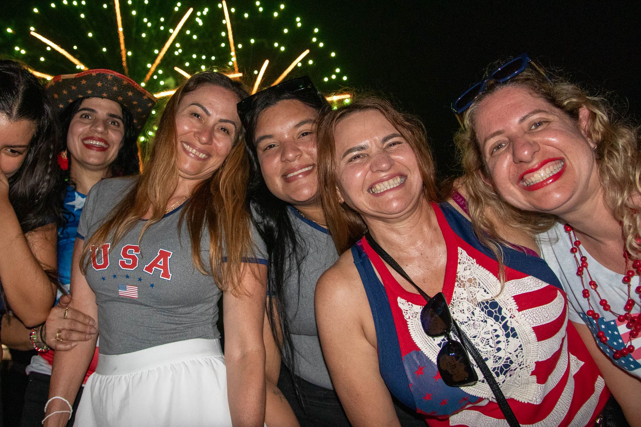 Person smiling wearing red, white and blue clothing 