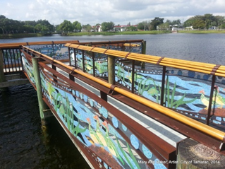 Mural paintings on the walls of a bridge above water