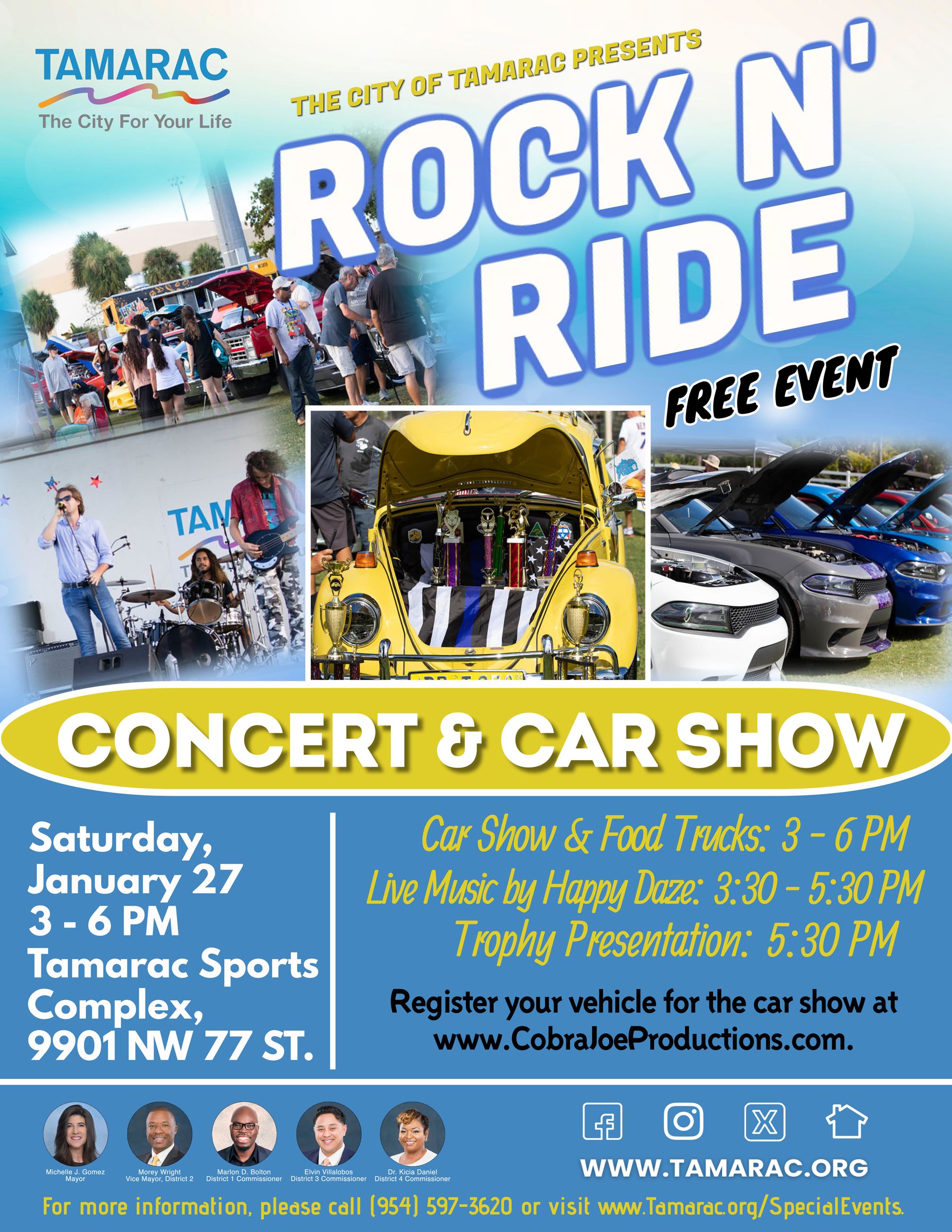 A crowd of people looking at a red car