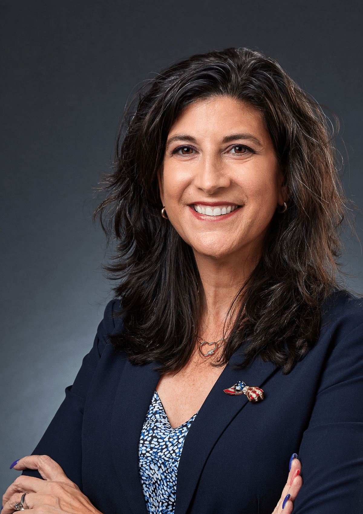 Mayor smiling with arms crossed